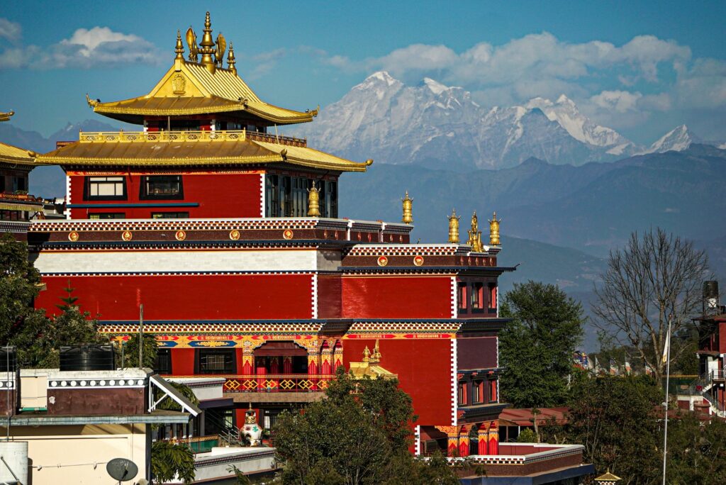 Thrangu Tashi Yangtse Monastery at Namo Buddha, Nepal, with snow-capped mountains in the background